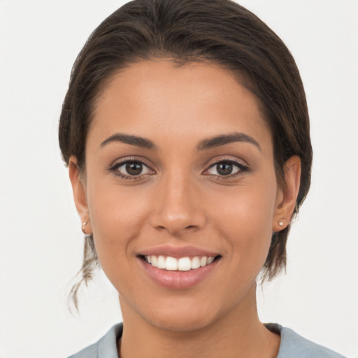 Joyful white young-adult female with medium  brown hair and brown eyes