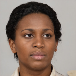 Neutral black young-adult female with medium  brown hair and brown eyes