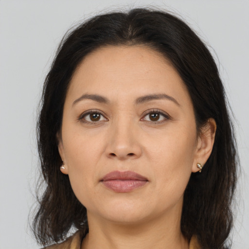 Joyful asian adult female with medium  brown hair and brown eyes