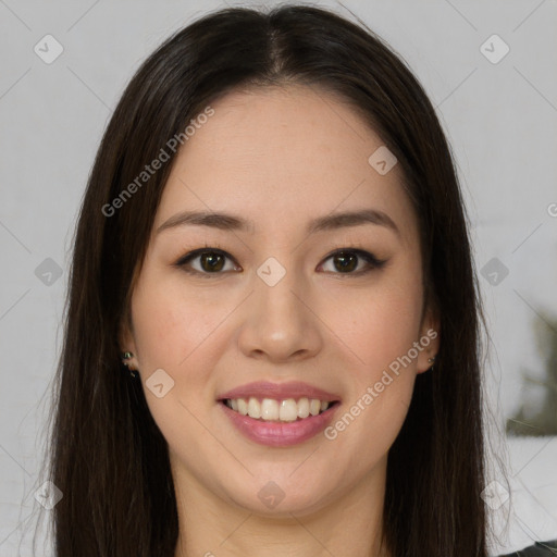 Joyful latino young-adult female with long  brown hair and brown eyes