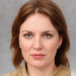 Joyful white young-adult female with medium  brown hair and blue eyes