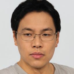 Neutral asian young-adult male with short  brown hair and brown eyes