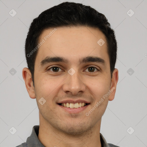 Joyful white young-adult male with short  black hair and brown eyes