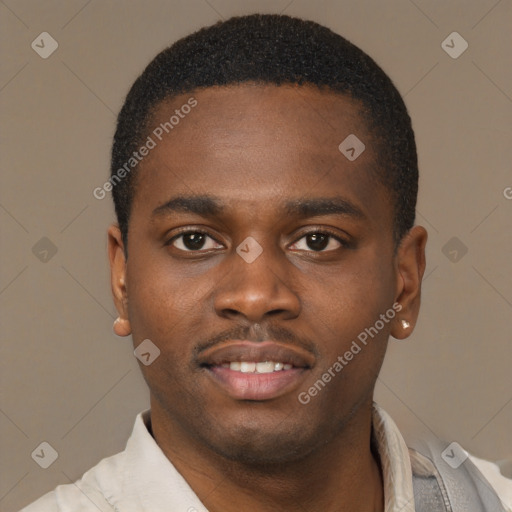 Joyful latino young-adult male with short  brown hair and brown eyes