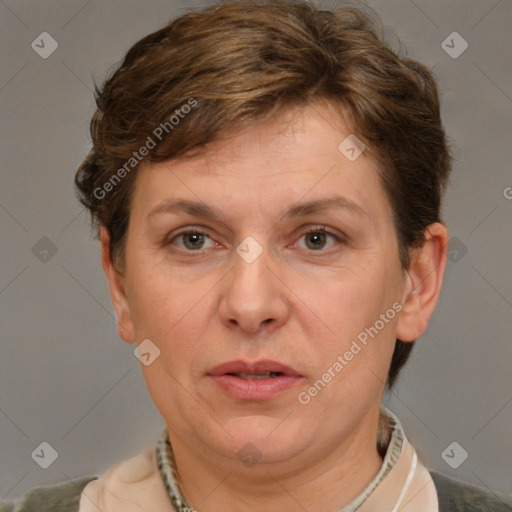 Joyful white adult female with short  brown hair and brown eyes