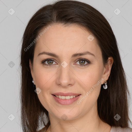 Joyful white adult female with long  brown hair and grey eyes