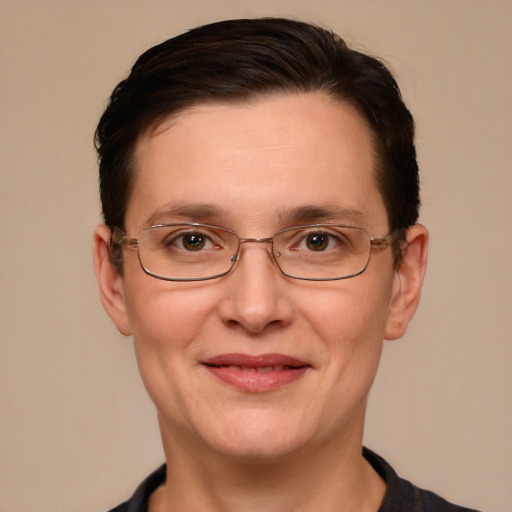 Joyful white adult female with short  brown hair and grey eyes