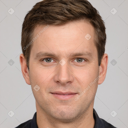 Joyful white adult male with short  brown hair and grey eyes