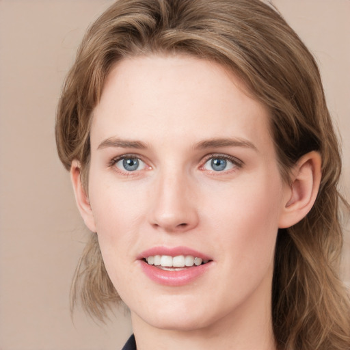 Joyful white young-adult female with medium  brown hair and blue eyes