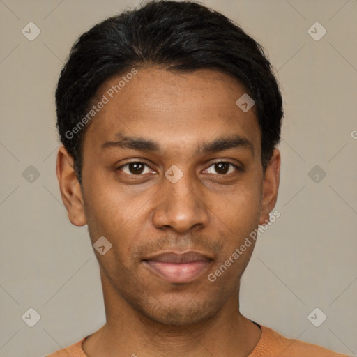 Joyful black young-adult male with short  black hair and brown eyes