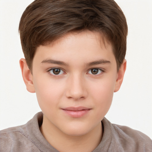 Joyful white child male with short  brown hair and brown eyes