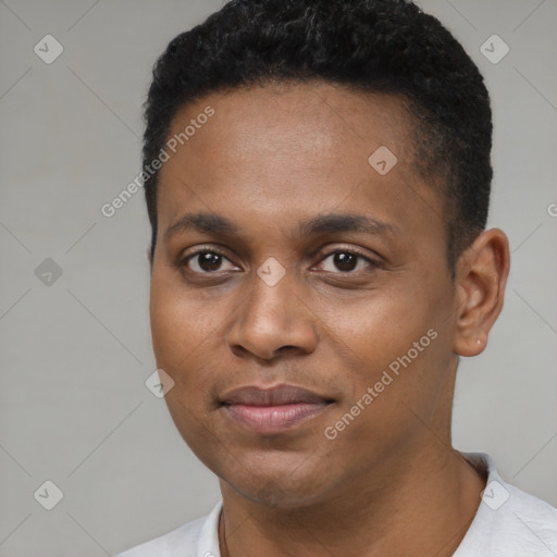 Joyful black young-adult male with short  black hair and brown eyes