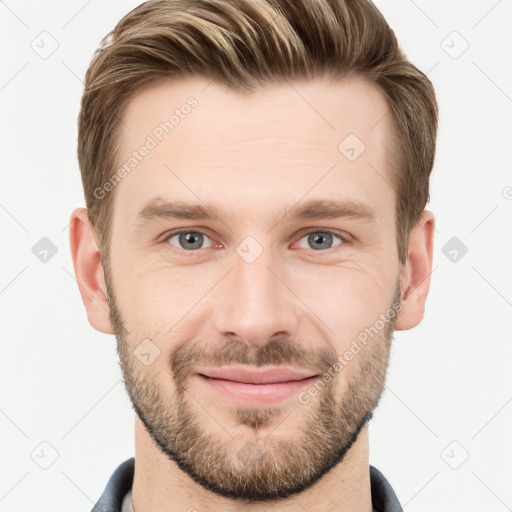 Joyful white young-adult male with short  brown hair and grey eyes