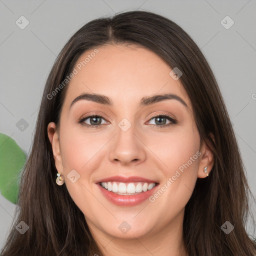 Joyful white young-adult female with long  brown hair and grey eyes