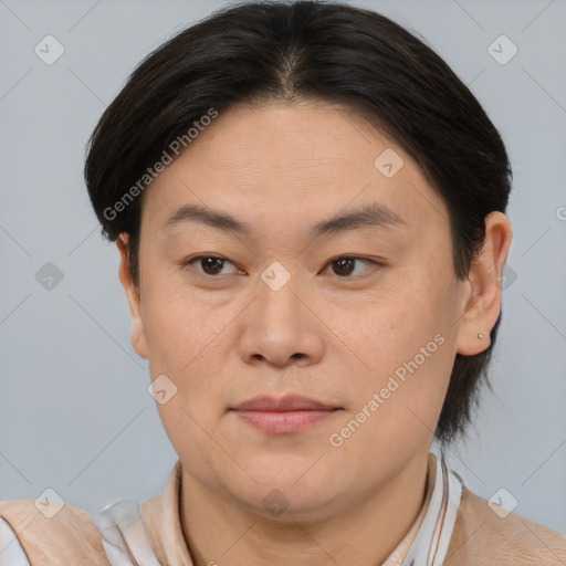 Joyful asian young-adult female with short  brown hair and brown eyes