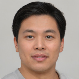 Neutral asian young-adult male with short  brown hair and brown eyes