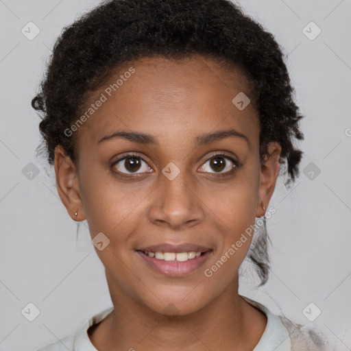 Joyful black young-adult female with short  brown hair and brown eyes