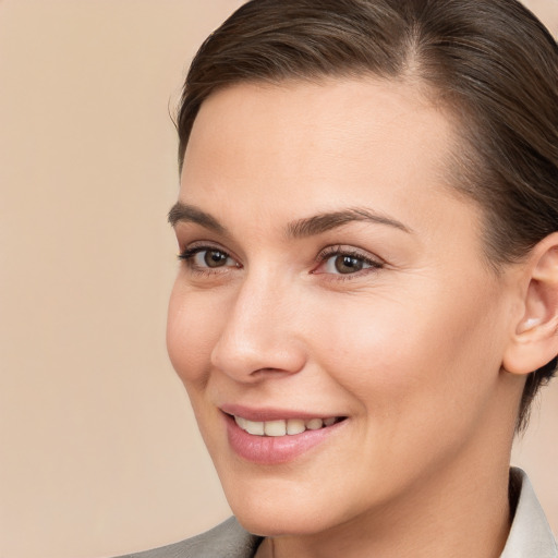 Joyful white young-adult female with medium  brown hair and brown eyes