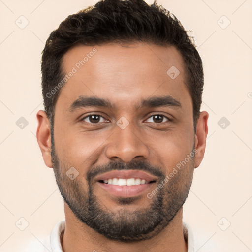 Joyful white young-adult male with short  black hair and brown eyes