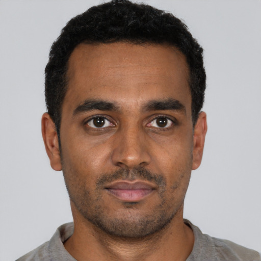 Neutral black young-adult male with short  black hair and brown eyes