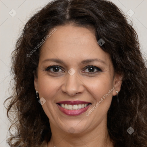 Joyful white adult female with long  brown hair and brown eyes