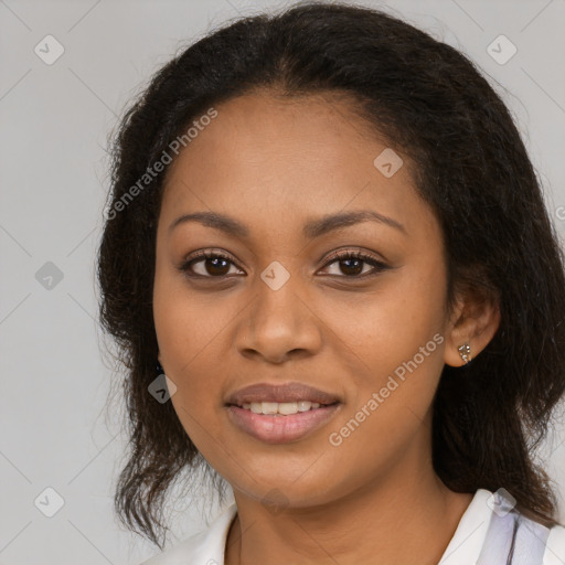 Joyful black young-adult female with long  brown hair and brown eyes