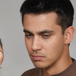 Neutral white young-adult male with short  black hair and brown eyes