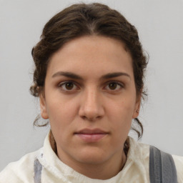 Neutral white young-adult female with short  brown hair and brown eyes