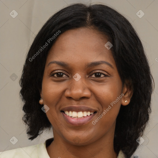 Joyful black young-adult female with medium  brown hair and brown eyes