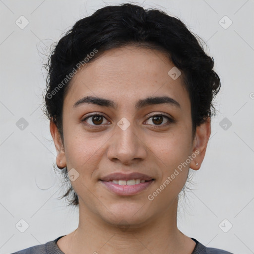 Joyful latino young-adult female with short  brown hair and brown eyes