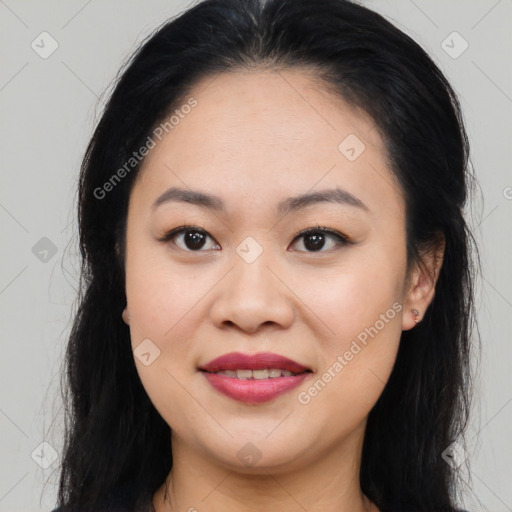 Joyful asian young-adult female with long  brown hair and brown eyes