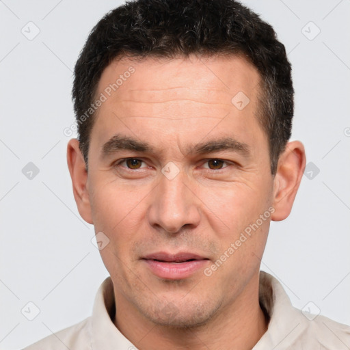 Joyful white adult male with short  brown hair and brown eyes