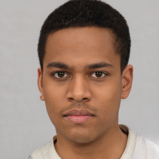 Neutral latino young-adult male with short  brown hair and brown eyes