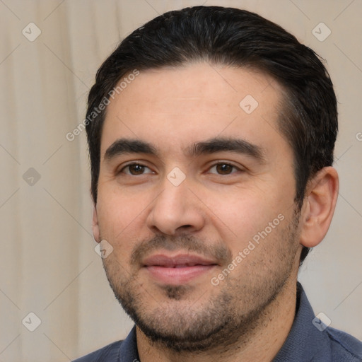 Joyful white young-adult male with short  black hair and brown eyes