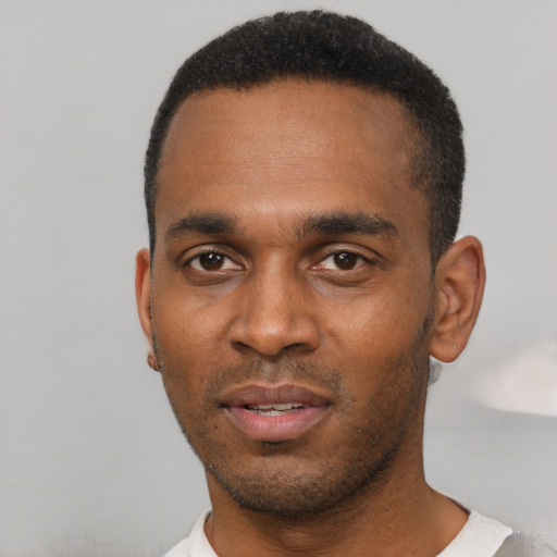 Neutral black young-adult male with short  black hair and brown eyes