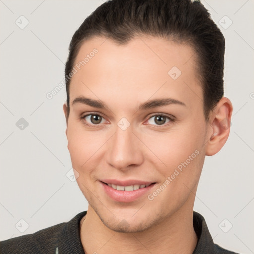 Joyful white young-adult female with short  brown hair and brown eyes