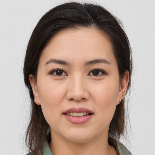 Joyful white young-adult female with medium  brown hair and brown eyes