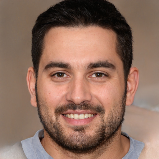 Joyful white young-adult male with short  black hair and brown eyes