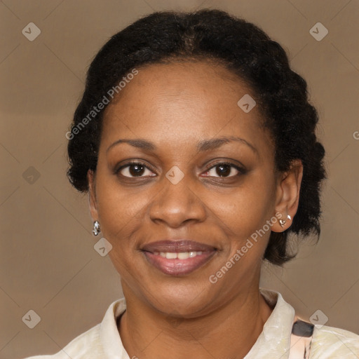 Joyful black adult female with short  brown hair and brown eyes