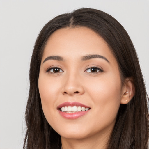 Joyful white young-adult female with long  black hair and brown eyes