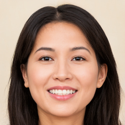 Joyful white young-adult female with long  brown hair and brown eyes