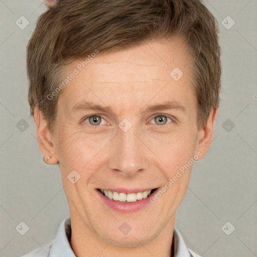 Joyful white adult male with short  brown hair and grey eyes