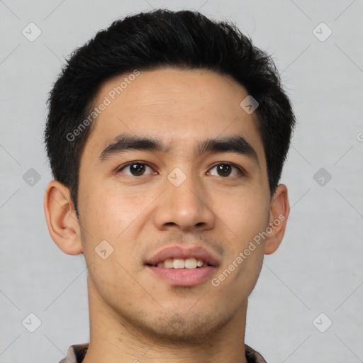 Joyful latino young-adult male with short  black hair and brown eyes