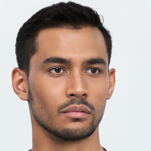 Neutral latino young-adult male with short  brown hair and brown eyes