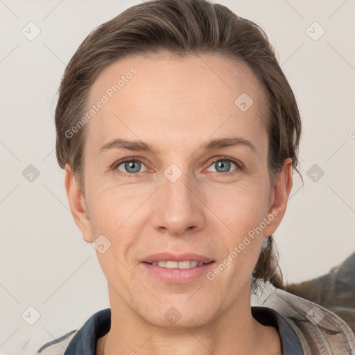 Joyful white adult female with short  brown hair and grey eyes