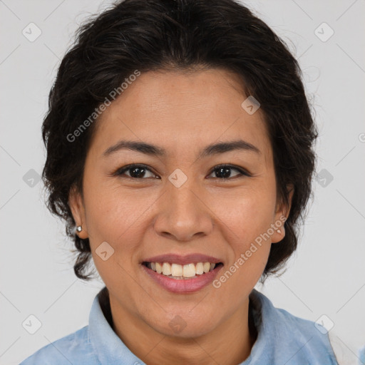 Joyful asian adult female with medium  brown hair and brown eyes