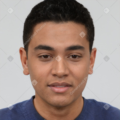 Joyful latino young-adult male with short  black hair and brown eyes