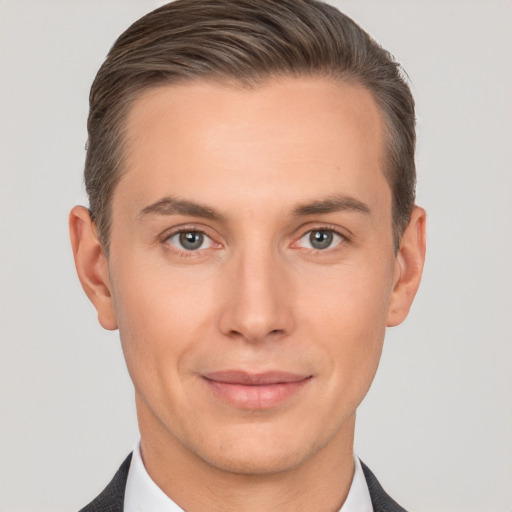 Joyful white young-adult male with short  brown hair and brown eyes