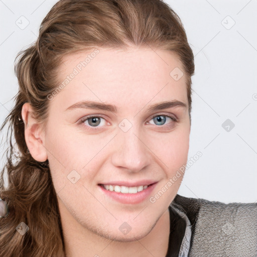 Joyful white young-adult female with long  brown hair and blue eyes