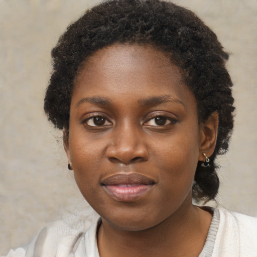 Neutral black young-adult female with medium  brown hair and brown eyes